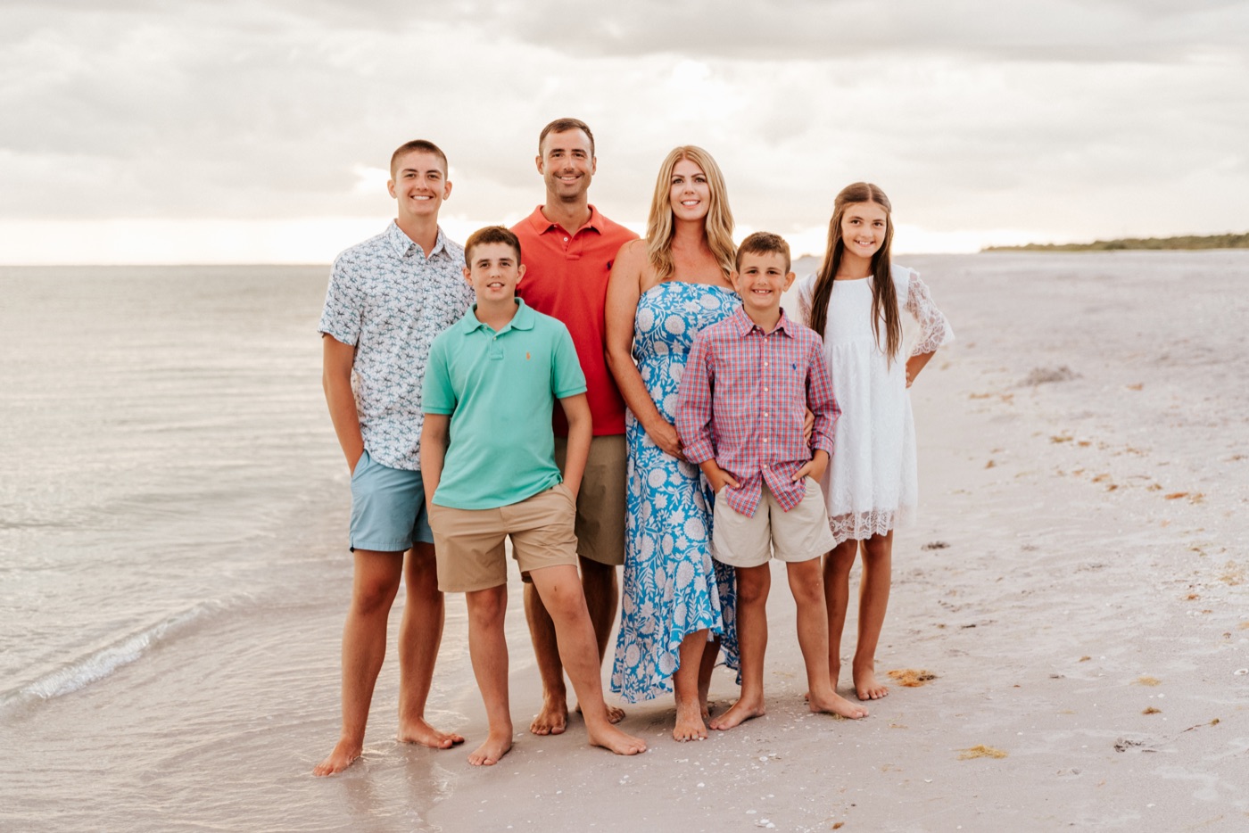 Rosalie and Joshua with their family on the beach — the family behind Way Maker Land Company